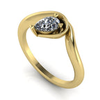 Enchanted pear diamond engagement ring in yellow gold, three-quarter angle view showing brilliant stone nestled in asymmetric organic setting