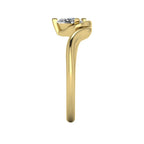 Enchanted pear diamond ring in yellow gold, side view showing clean interior gallery and low-set asymmetric profile