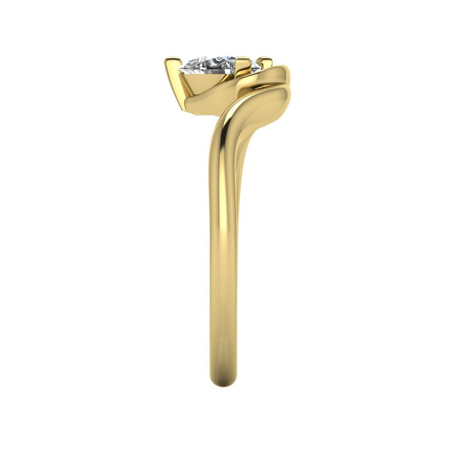 Enchanted pear diamond ring in yellow gold, side view showing clean interior gallery and low-set asymmetric profile
