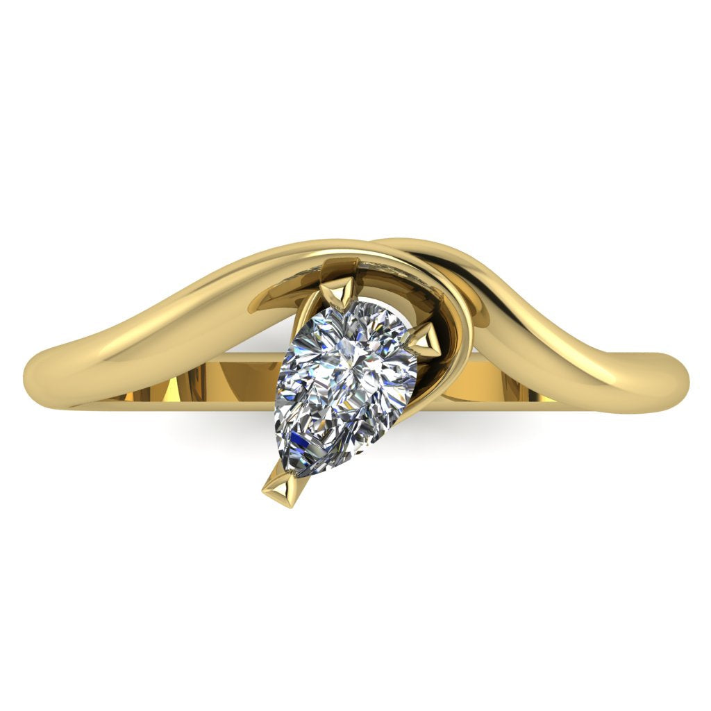 Enchanted pear shaped diamond ring in yellow gold, overhead top-down view showing brilliant stone and fluid sweeping band design