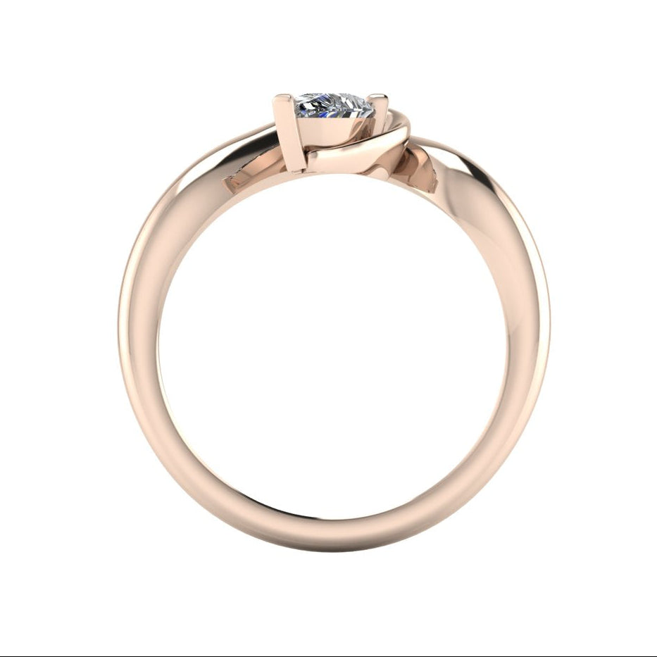 Enchanted pear shaped lab grown diamond asymmetric solitaire engagement ring in rose gold, through finger view showing brilliant diamond and sculptural sweeping band