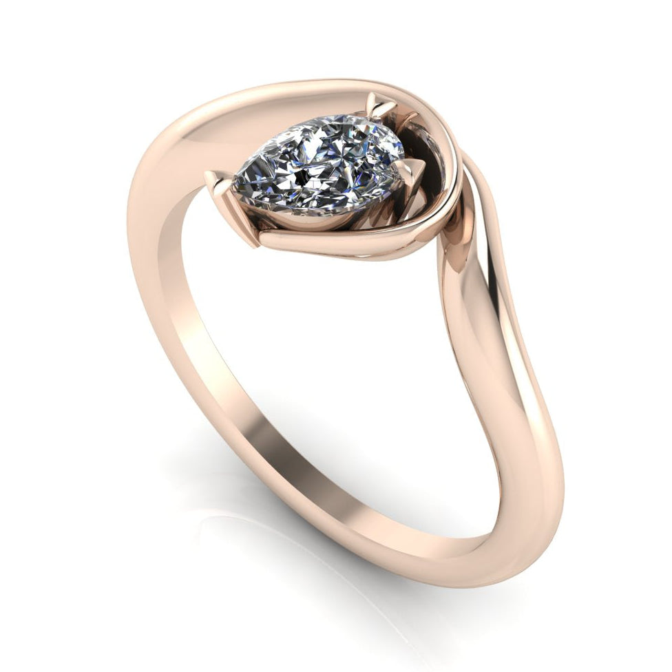 Enchanted pear shaped lab grown diamond asymmetric solitaire engagement ring in rose gold, front view showing brilliant diamond and sculptural sweeping band