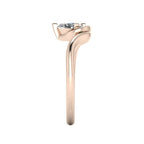 Enchanted pear lab grown diamond ring in rose gold, side profile view showing sculptural asymmetric height and elegant sweeping band silhouette