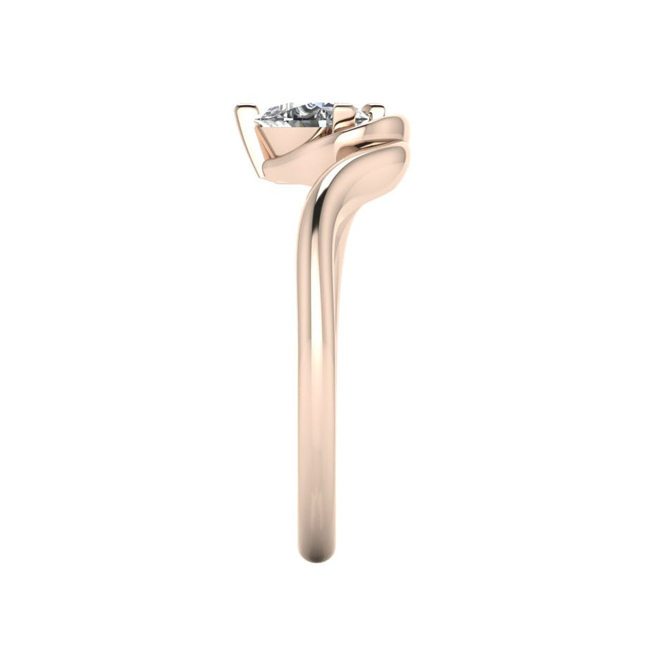 Enchanted pear lab grown diamond ring in rose gold, side profile view showing sculptural asymmetric height and elegant sweeping band silhouette
