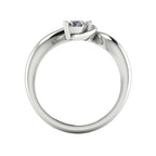 Enchanted pear diamond ring in white gold, through-finger view showing clean interior gallery and low-set asymmetric profile