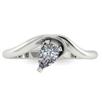 Enchanted pear shaped lab grown diamond ring in white gold, overhead top-down view showing brilliant stone and fluid sweeping band design