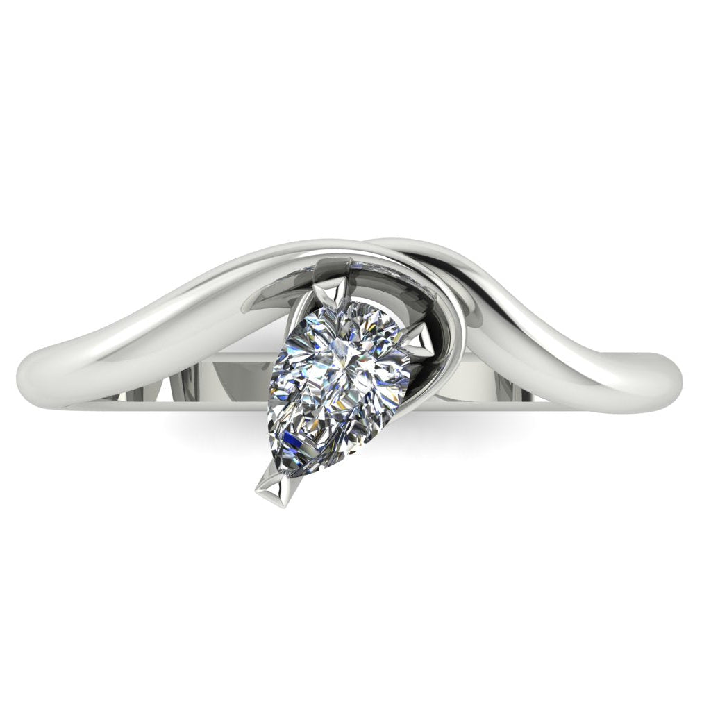 Enchanted pear shaped lab grown diamond ring in white gold, overhead top-down view showing brilliant stone and fluid sweeping band design