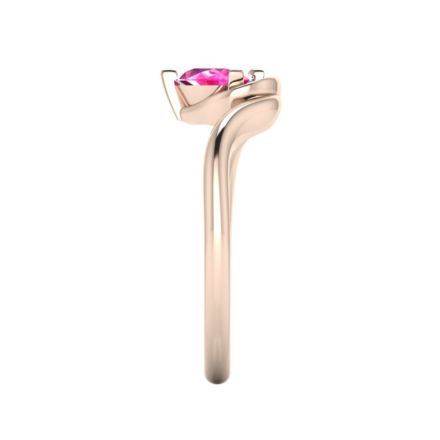 Enchanted pear pink sapphire ring in rose gold, side profile view showing extraordinary sculptural asymmetric height and elegant sweeping band silhouette