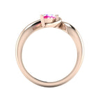 Enchanted pear pink sapphire ring in rose gold, through-finger view showing clean interior band and low-set asymmetric profile