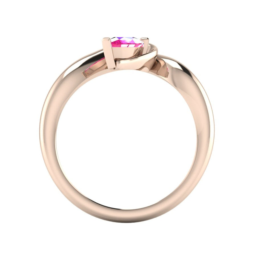 Enchanted pear pink sapphire ring in rose gold, through-finger view showing clean interior band and low-set asymmetric profile