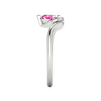 Enchanted pear pink sapphire ring in white gold, side profile view showing dramatic sculptural asymmetric height and elegant sweeping band silhouette