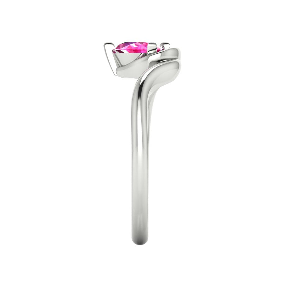 Enchanted pear pink sapphire ring in white gold, side profile view showing dramatic sculptural asymmetric height and elegant sweeping band silhouette