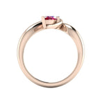 Enchanted pear ruby ring in rose gold, straight-on through-finger view showing clean band interior and low-set asymmetric profile
