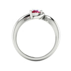Enchanted pear ruby ring in white gold, through-finger view showing clean interior band and low-set asymmetric profile