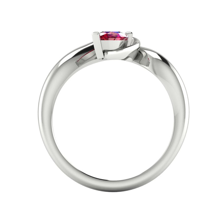 Enchanted pear ruby ring in white gold, through-finger view showing clean interior band and low-set asymmetric profile