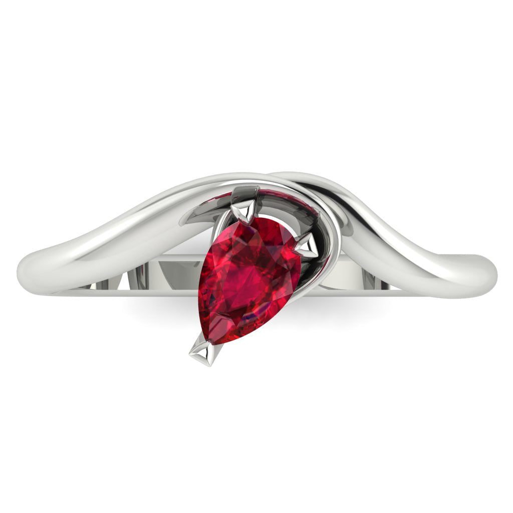 Enchanted pear shaped ruby ring in white gold, overhead top-down view showing vivid red stone and fluid sweeping band design