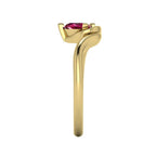 Enchanted pear ruby ring in yellow gold, dramatic side profile showing extraordinary sculptural height and elegantly curved asymmetric shank