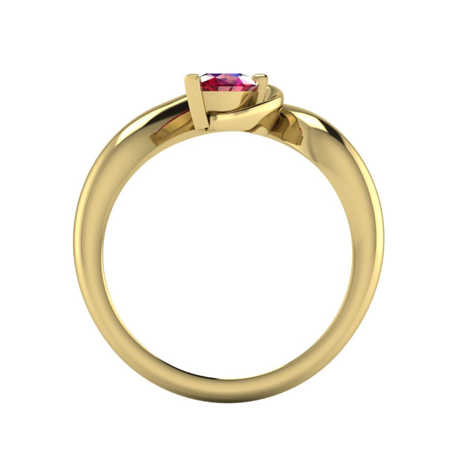 Enchanted pear ruby ring in yellow gold, straight-on view showing clean band interior and low-set asymmetric profile
