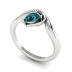Enchanted teal sapphire pear engagement ring in white gold, three-quarter angle view showing stone and band detail