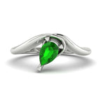 Enchanted pear shaped tsavorite asymmetric solitaire ring in white gold, front view showing sculptural band