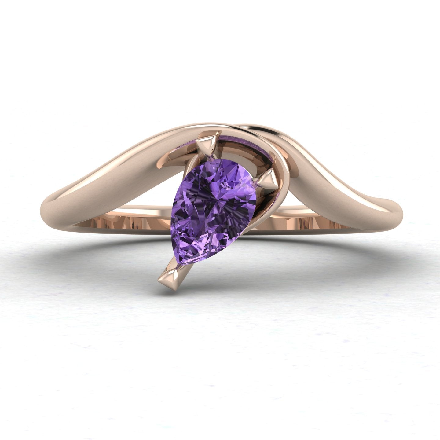 Enchanted pear shaped violet sapphire asymmetric solitaire engagement ring in rose gold, front view showing vivid lavender stone and sculptural sweeping band