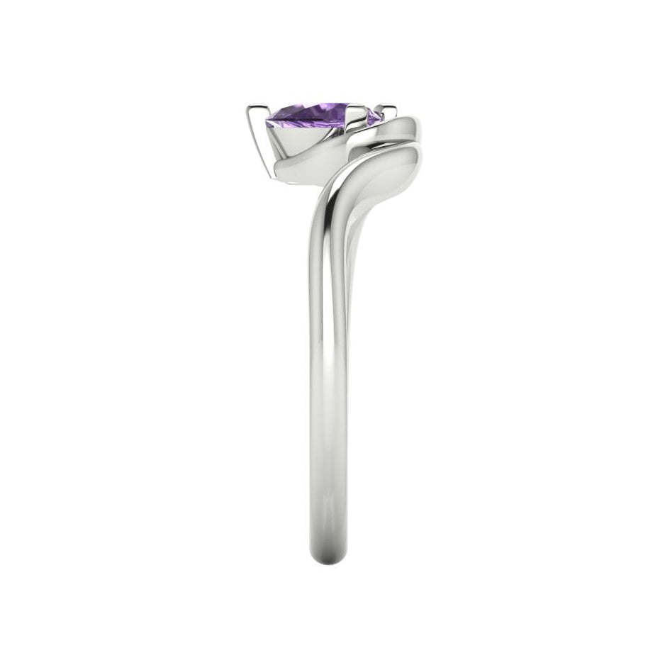 Enchanted pear shaped violet sapphire ring in white gold, overhead side view showing ethereal lavender stone and fluid sweeping band design