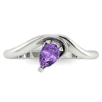 Enchanted pear shaped violet sapphire ring in white gold, overhead top-down view showing ethereal lavender stone and fluid sweeping band design