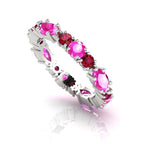 18ct white gold eternity ring featuring alternating marquise rubies and pink sapphires in a claw setting.