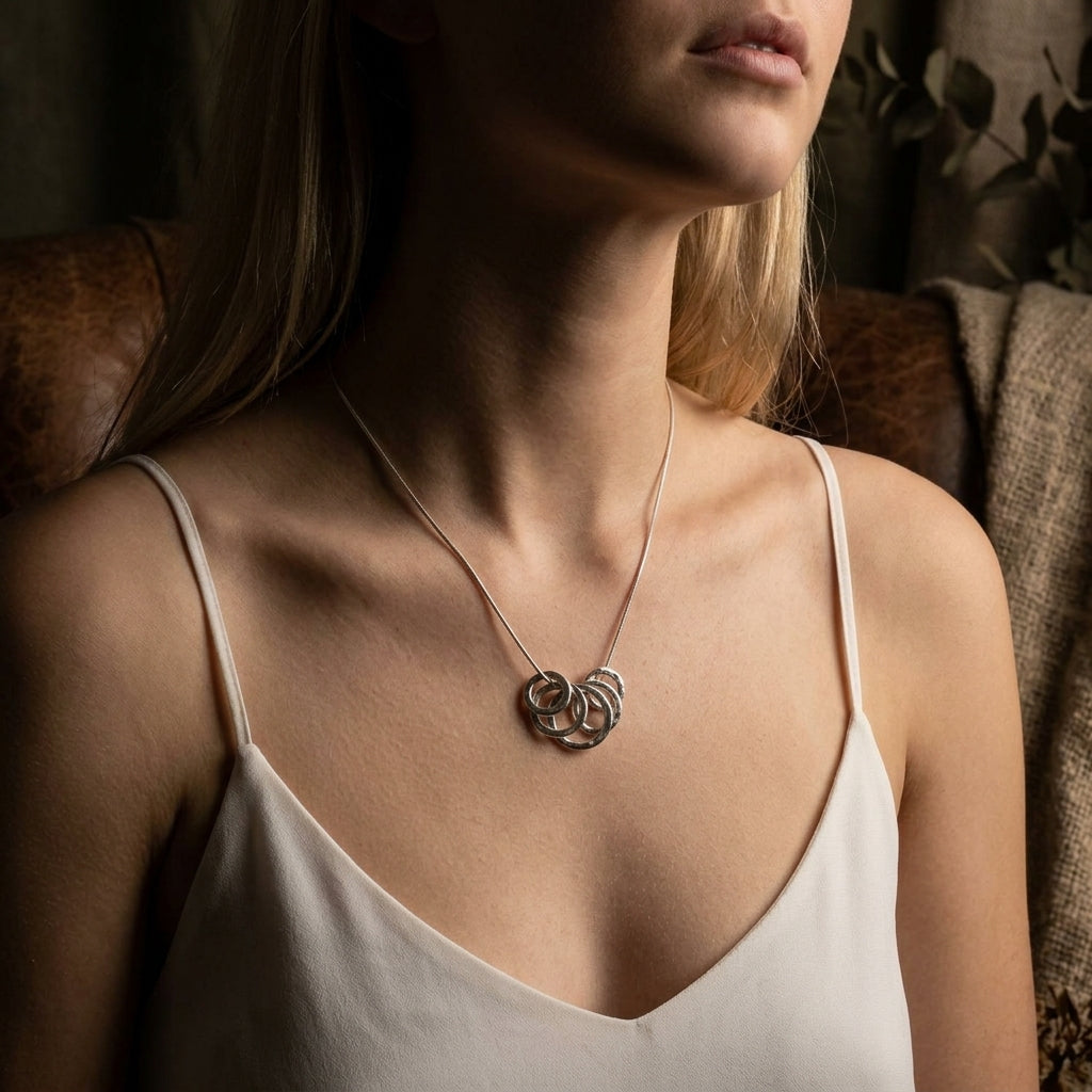 Scale view of the 5-link sterling silver Model image Vanilla pendant demonstrating the length and statement scale of the design.