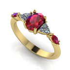 Maisie oval ruby and diamond five stone engagement ring in 18ct yellow gold, three-quarter view