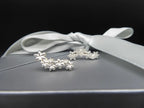 Close-up of the marquise-shaped petals on Fleur cascading flower earrings in recycled sterling silver