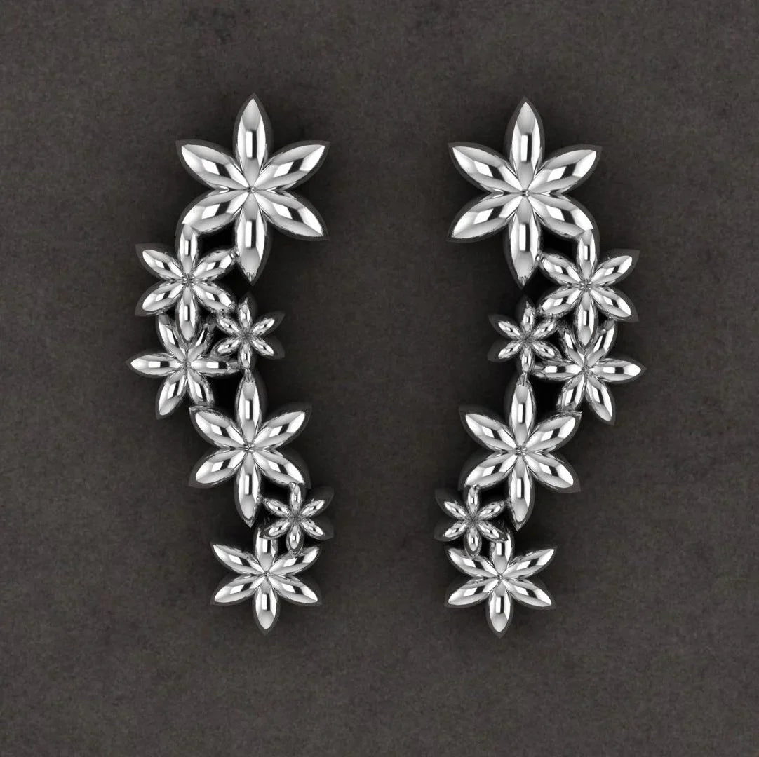 Pair of Fleur cascading flower earrings in recycled sterling silver showing the seven-flower drop design