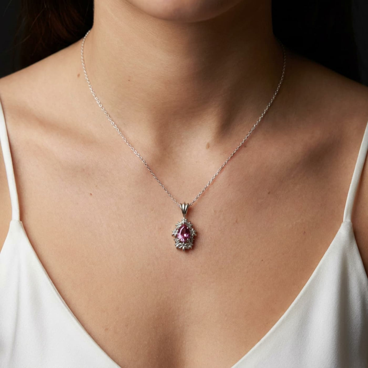 Fleur pink tourmaline pendant necklace in recycled sterling silver with an adjustable 16 to 18 inch chain on model
