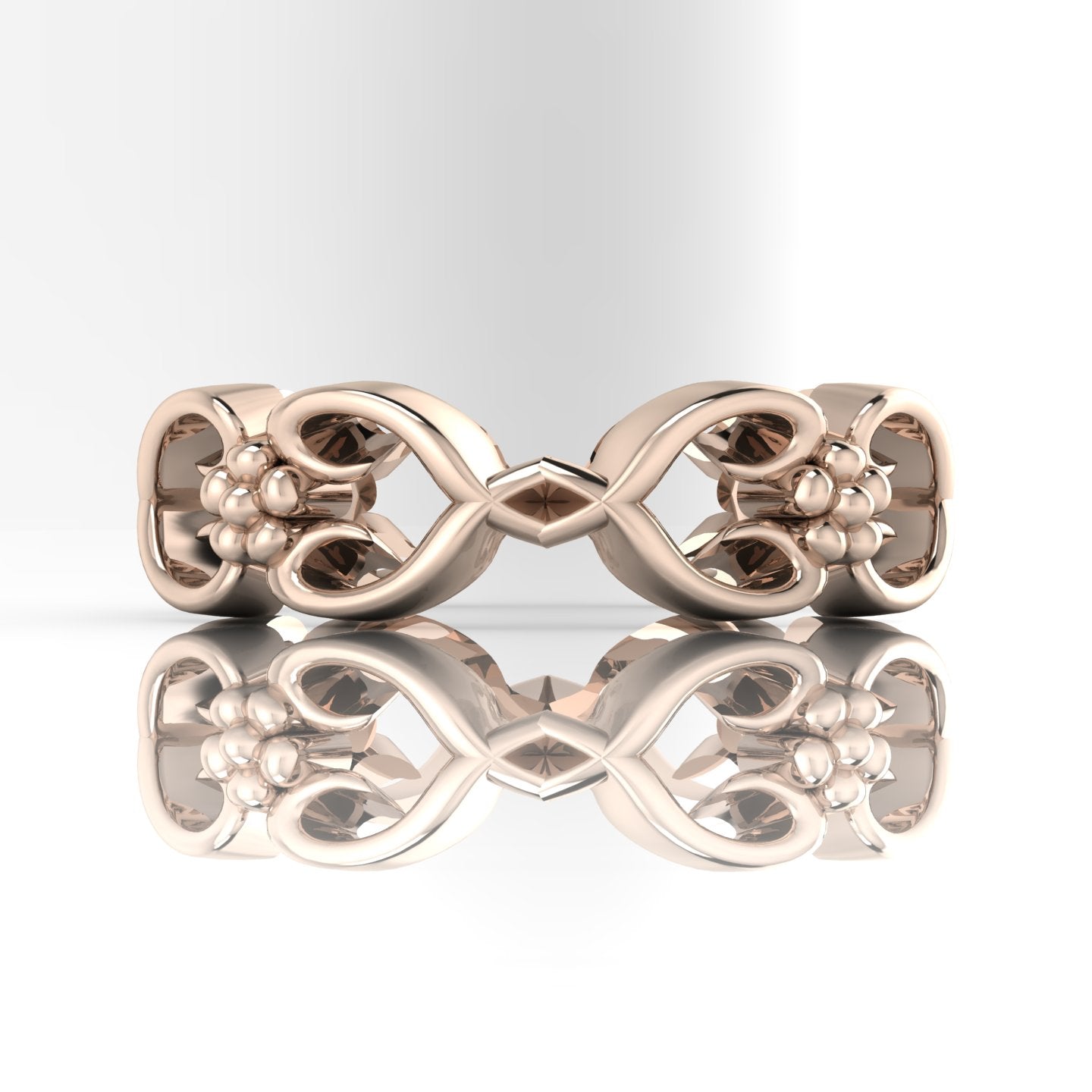 Flowers On The Vine floral wedding ring in 18ct rose gold, front view with reflection showing open vine and blossom detail