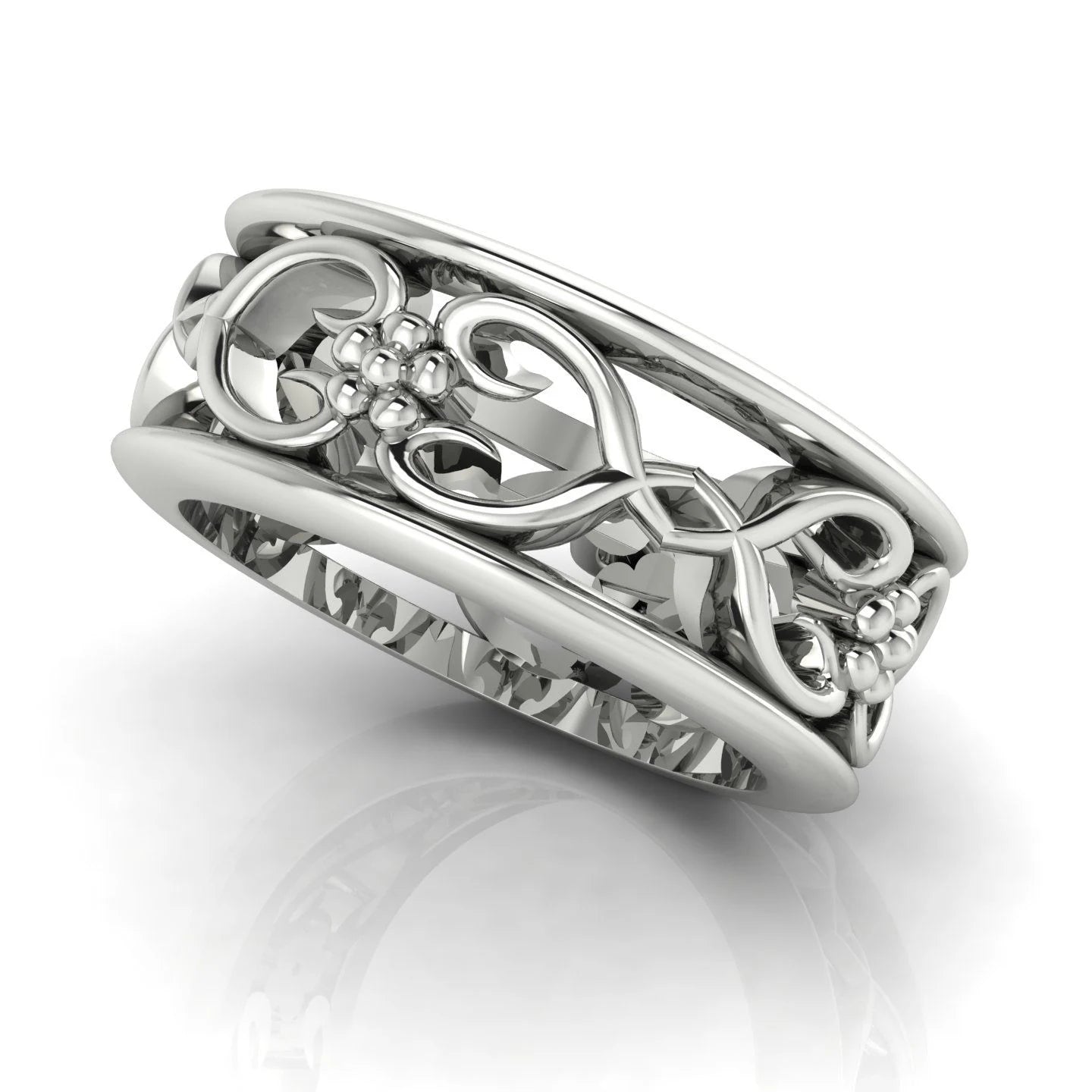 Flowers On The Vine floral wedding ring in white gold, side angle showing sculptural vine and blossom detail