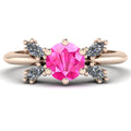 Flutterby pink sapphire butterfly engagement ring front view — round pink sapphire centre with four white marquise diamond wings in recycled 18ct rose gold by Nude Jewellery