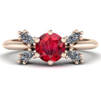 Flutterby ruby butterfly engagement ring front view — round ruby centre with four white marquise diamond wings in recycled 18ct rose gold by Nude Jewellery
