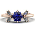 Flutterby blue sapphire butterfly engagement ring front view — round blue sapphire centre with four marquise diamond wings in recycled 18ct rose gold by Nude Jewellery