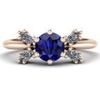 Flutterby blue sapphire butterfly engagement ring front view — round blue sapphire centre with four marquise diamond wings in recycled 18ct rose gold by Nude Jewellery