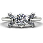 Flutterby diamond butterfly engagement ring front view — brilliant-cut centre diamond with four marquise-cut wings in platinum by Nude Jewellery