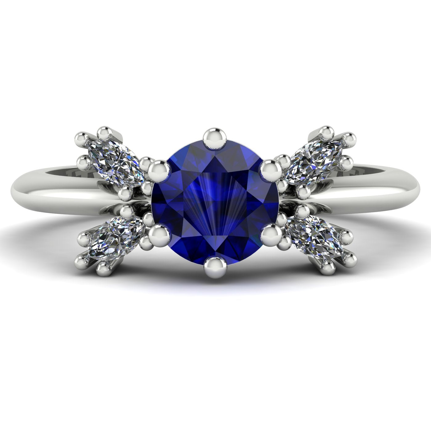 Flutterby blue sapphire butterfly engagement ring front view — blue sapphire centre with four white marquise diamond wings in recycled 18ct white gold by Nude Jewellery