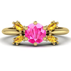 Flutterby pink sapphire and yellow diamond butterfly engagement ring front view — pink sapphire centre with four marquise yellow diamond wings in recycled 18ct yellow gold by Nude Jewellery