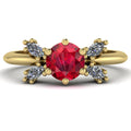 Flutterby ruby butterfly engagement ring front view — vibrant red ruby centre with four marquise diamond wings in recycled 18ct yellow gold by Nude Jewellery