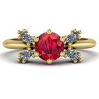 Flutterby ruby butterfly engagement ring front view — vibrant red ruby centre with four marquise diamond wings in recycled 18ct yellow gold by Nude Jewellery