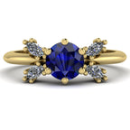 Flutterby blue sapphire butterfly engagement ring front view — deep blue sapphire centre with four marquise diamond wings in recycled 18ct yellow gold by Nude Jewellery