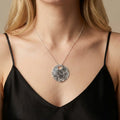 Glitter Ball Silver Disk Necklace in sterling silver — model wearing the textured disk pendant on a fine chain