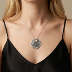 Glitter Ball Silver Disk Necklace in sterling silver — model wearing the textured disk pendant on a fine chain