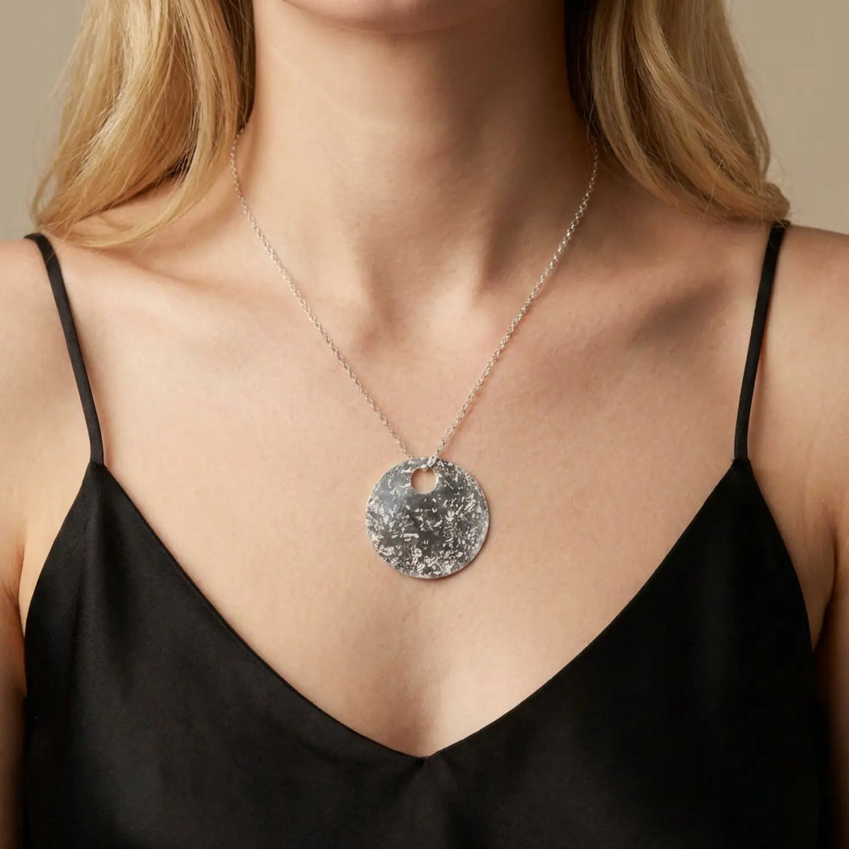 Glitter Ball Silver Disk Necklace in sterling silver — model wearing the textured disk pendant on a fine chain