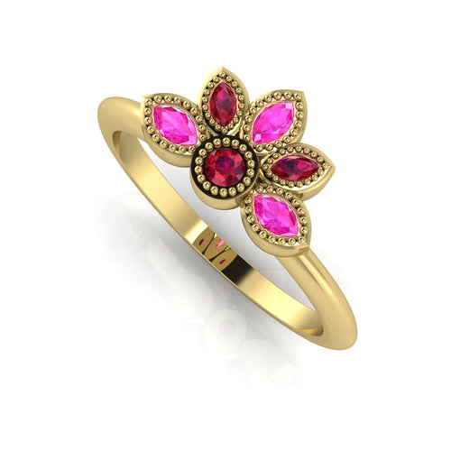 Perspective view of a handmade 18ct yellow gold ring with a ruby and pink sapphire cluster and intricate beaded details.