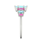 Harlequin gemstone ring with a central aquamarine and pink sapphire accents - side view